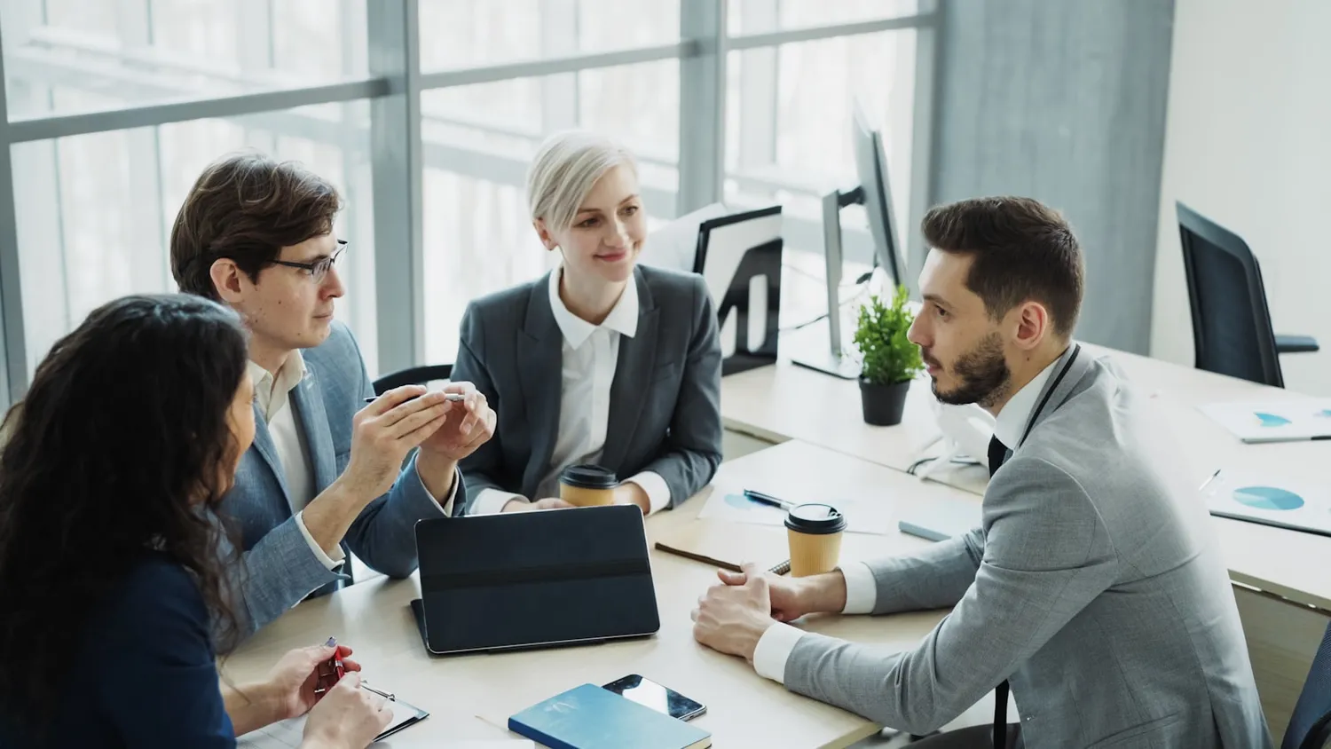 Select Talent HR consultants collaborating with a client team in a modern office